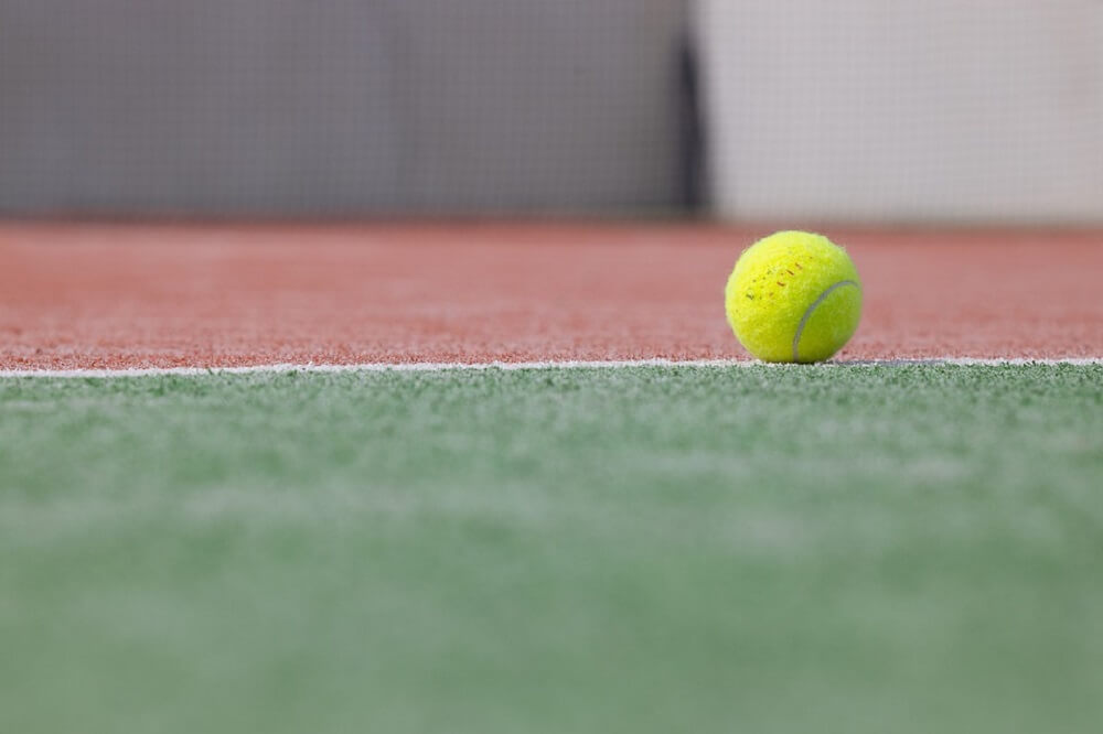 Tennis Ball on Tennis Court